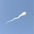 sperm shaped wind sock flying from a flag pole